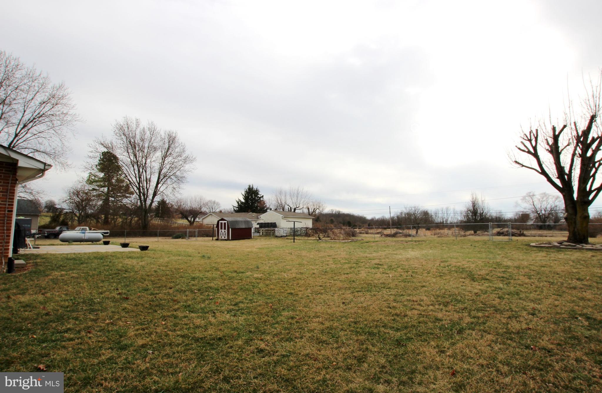 48 Apex Circle Ranson, WV 25438 - Photo 22 of 24 a view of a large body of water with lots of trees