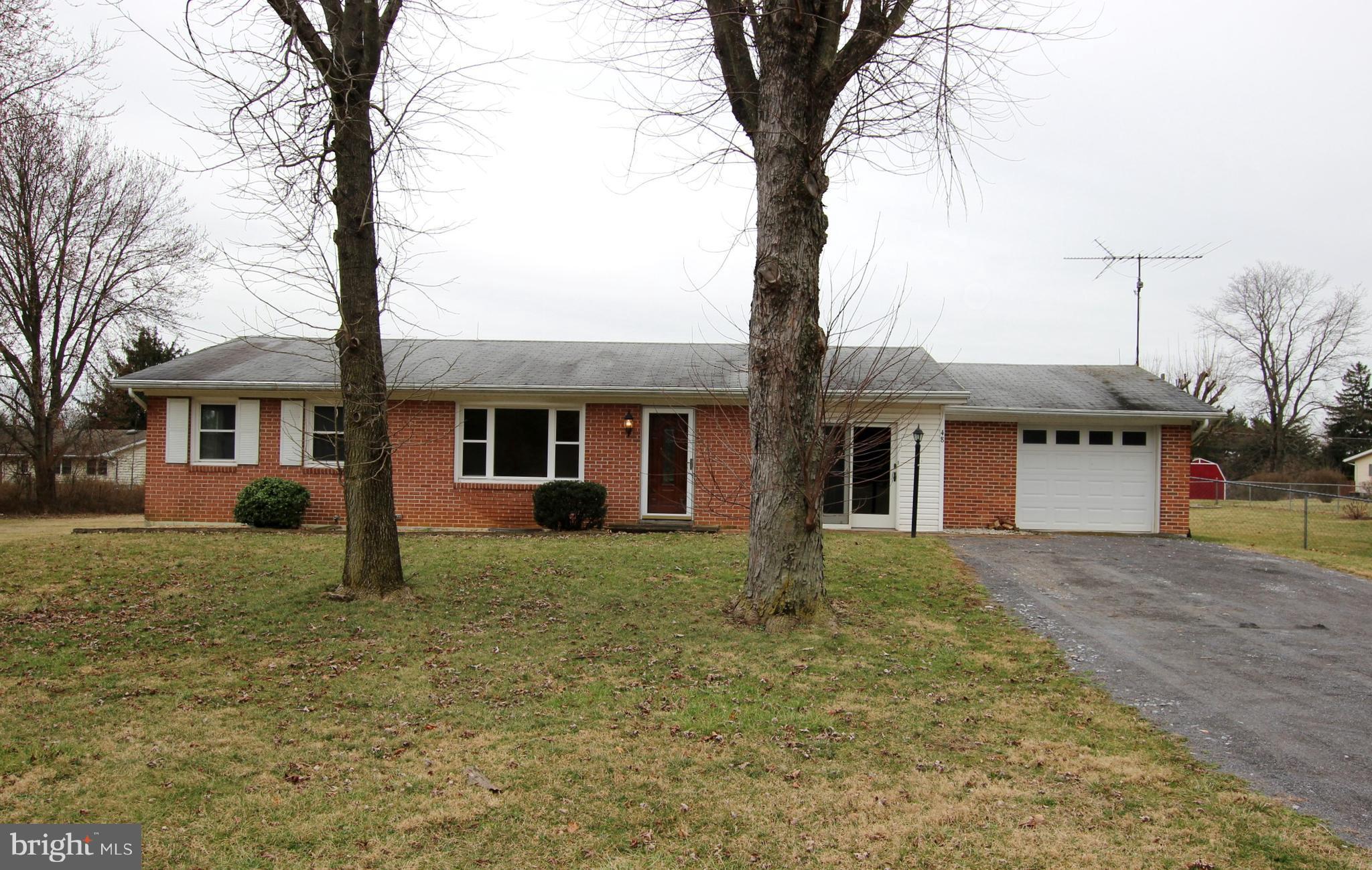 48 Apex Circle Ranson, WV 25438 - Photo 4 of 24 a front view of a house with yard and trees