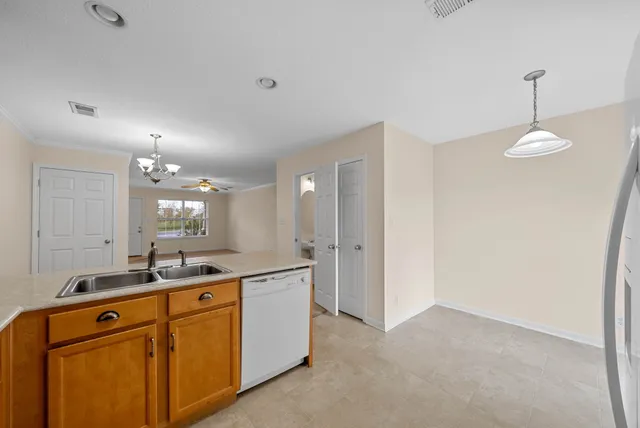 a room with sink and mirror