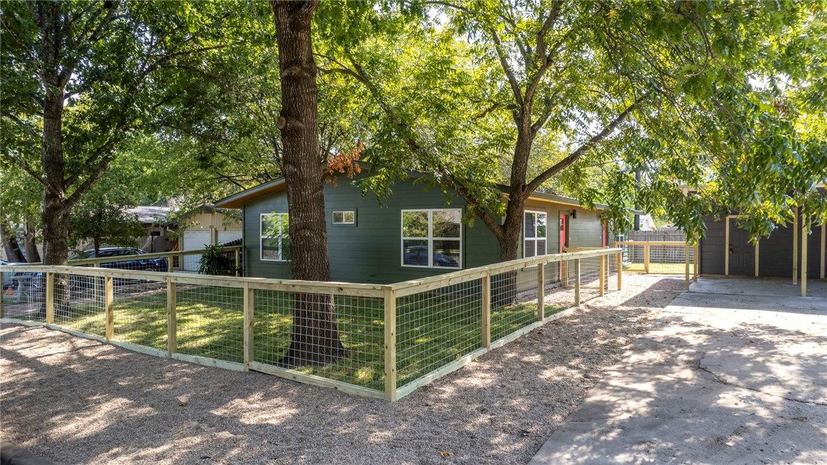 1509 Braes Ridge Drive, Unit A Austin, TX 78723 - Photo 16 of 17 Fenced in yard with mature trees