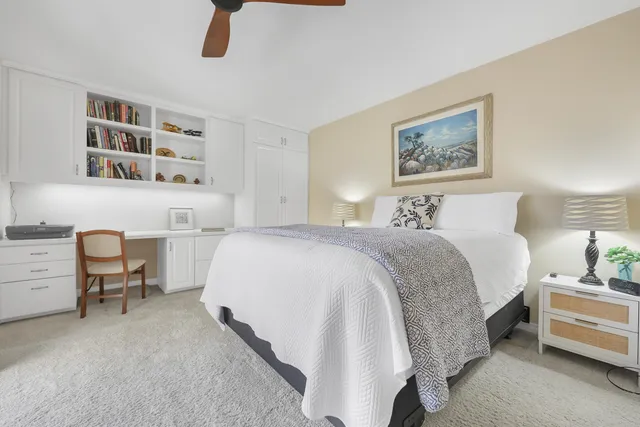 a bedroom with a bed and a cabinets