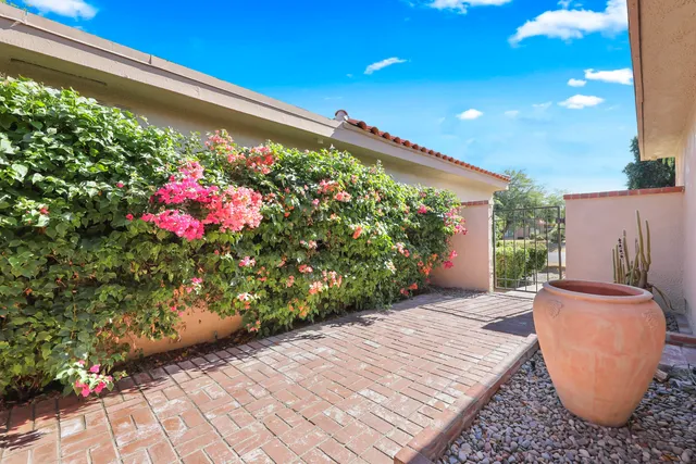a view of a patio with swimming pool