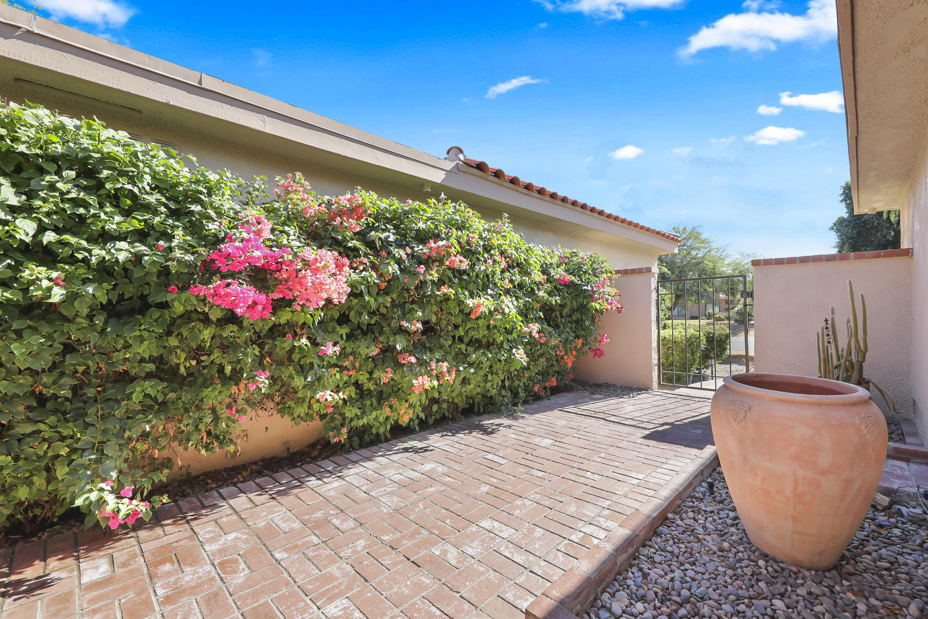 48 Palma Drive Rancho Mirage, CA 92270 - Photo 22 of 52 a front view of a house with a yard