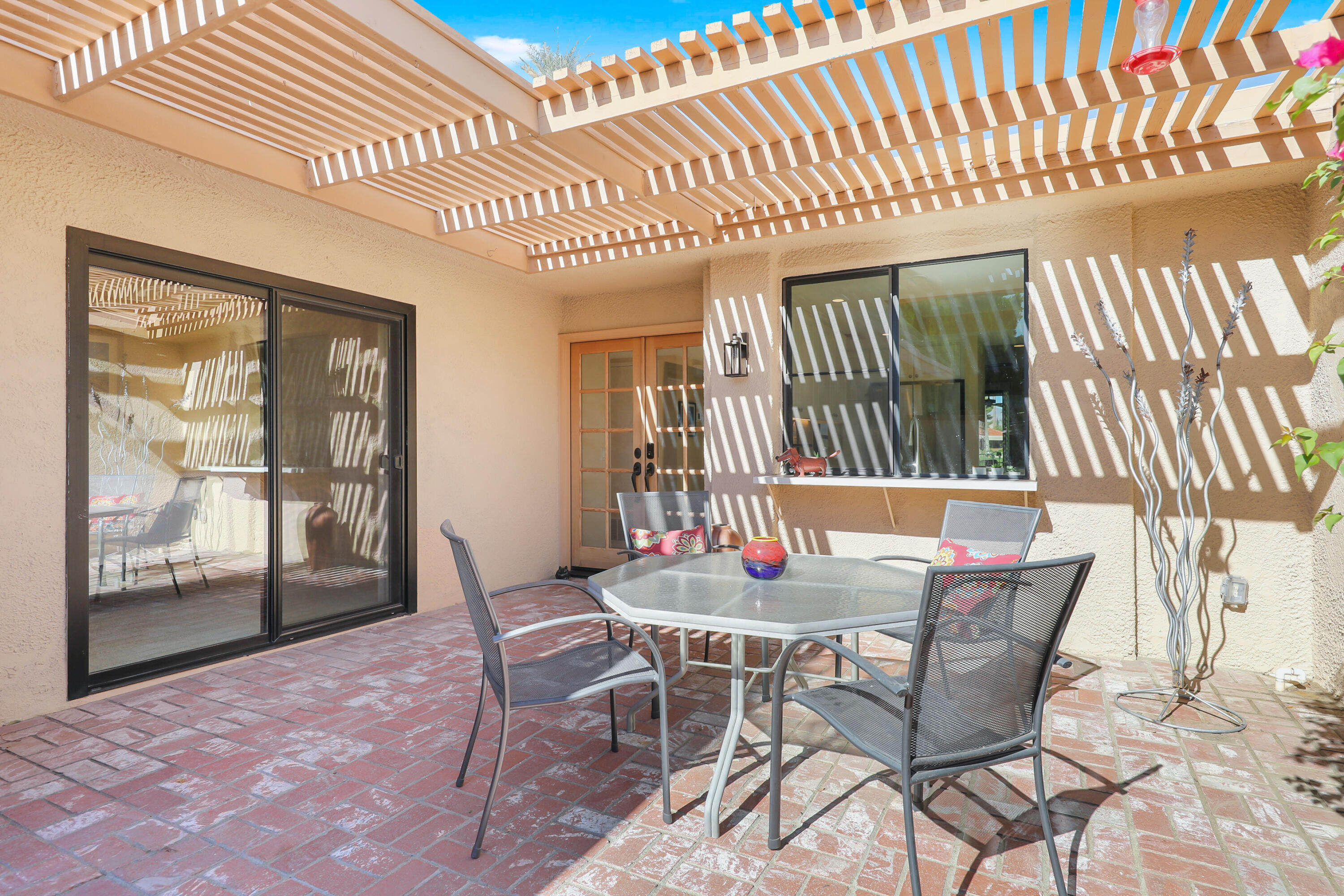 48 Palma Drive Rancho Mirage, CA 92270 - Photo 23 of 52 a dining room with a wooden table and chairs