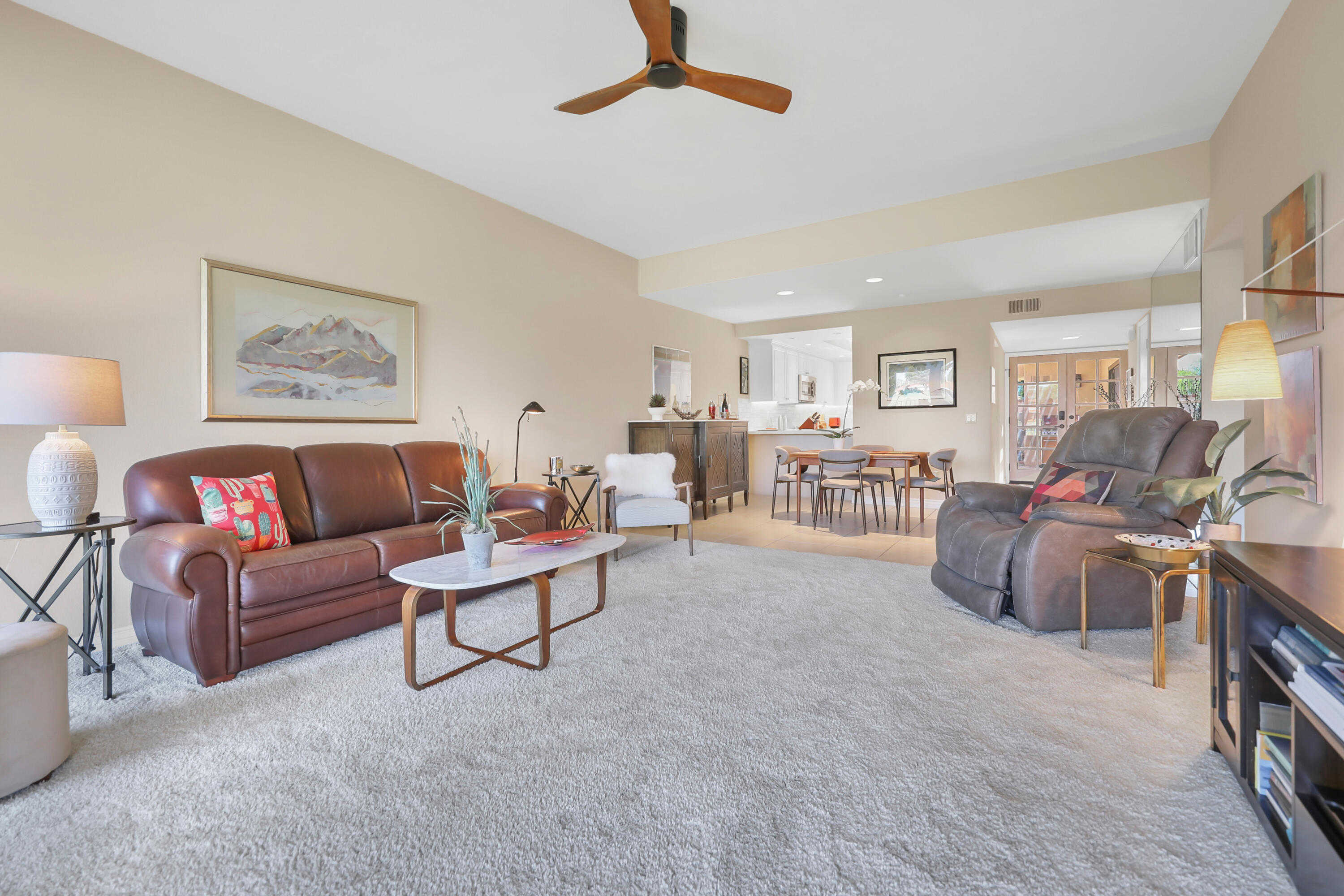 48 Palma Drive Rancho Mirage, CA 92270 - Photo 4 of 52 a living room with furniture and a flat screen tv