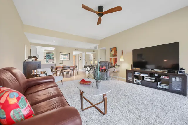 a view of a livingroom with furniture window and outside view
