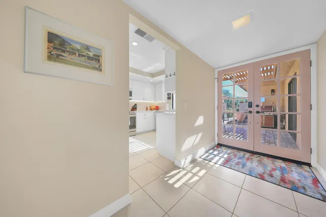a view of a livingroom with furniture and a table kitchen