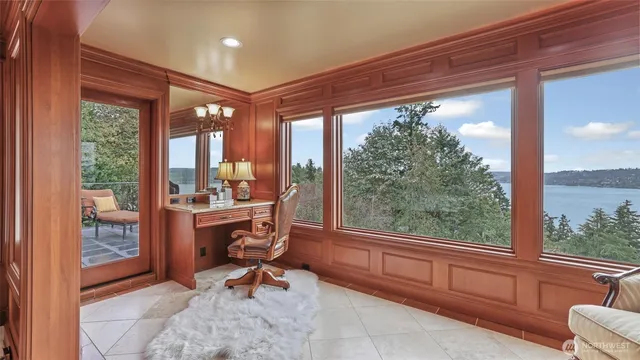 a view of a large room with wooden floor and furniture