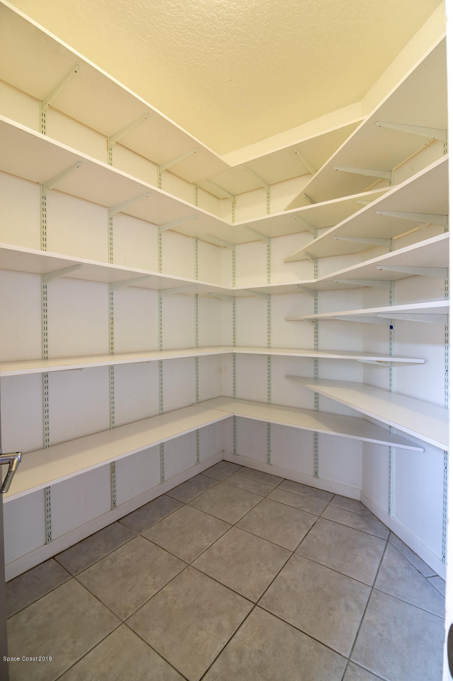 3081 Rio Baya North Melbourne, FL 32903 - Photo 16 of 31 a view of a room with shelves