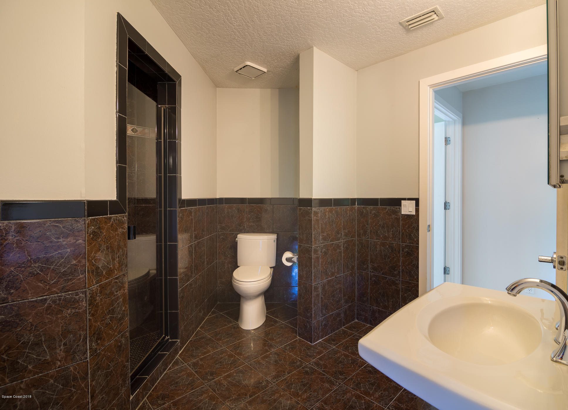 3081 Rio Baya North Melbourne, FL 32903 - Photo 21 of 31 a bathroom with a sink and a toilet