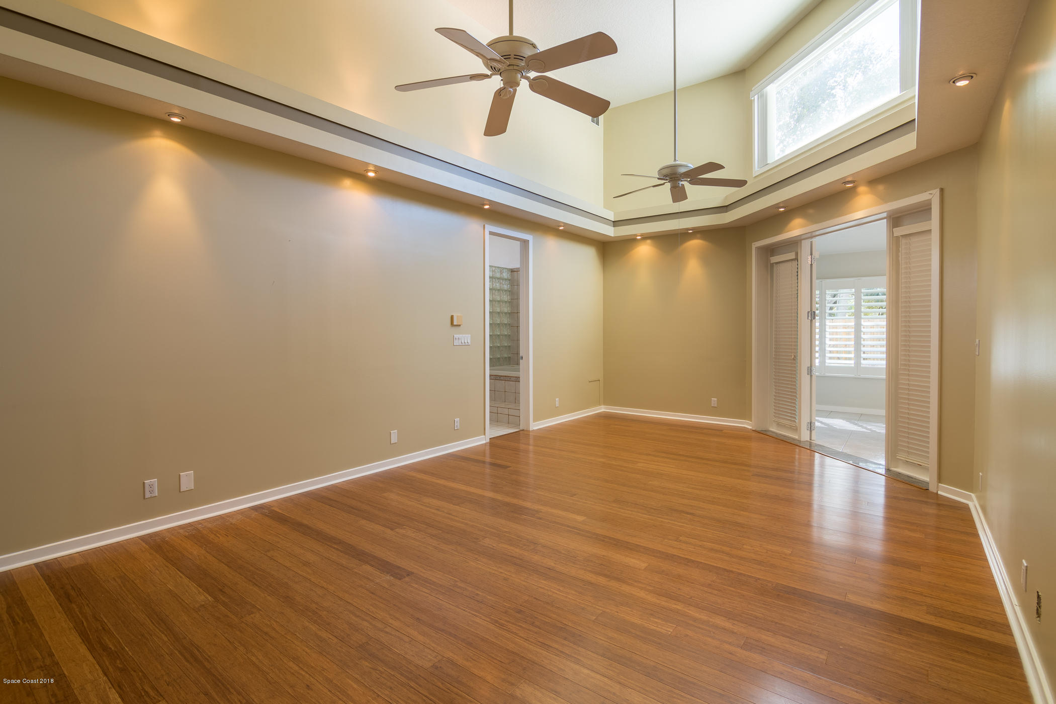 3081 Rio Baya North Melbourne, FL 32903 - Photo 22 of 31 a view of a room with wooden floor and ceiling fan