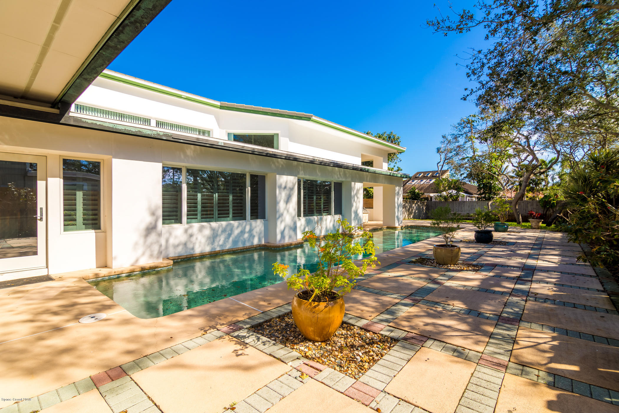 3081 Rio Baya North Melbourne, FL 32903 - Photo 25 of 31 a front view of a house with sitting area