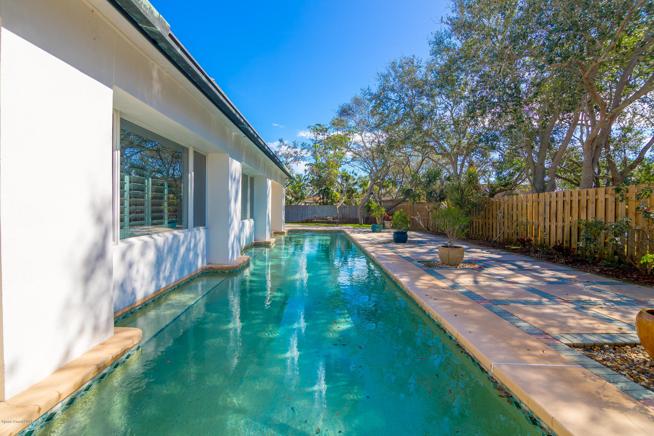 3081 Rio Baya North Melbourne, FL 32903 - Photo 26 of 31 a view of a backyard with large trees