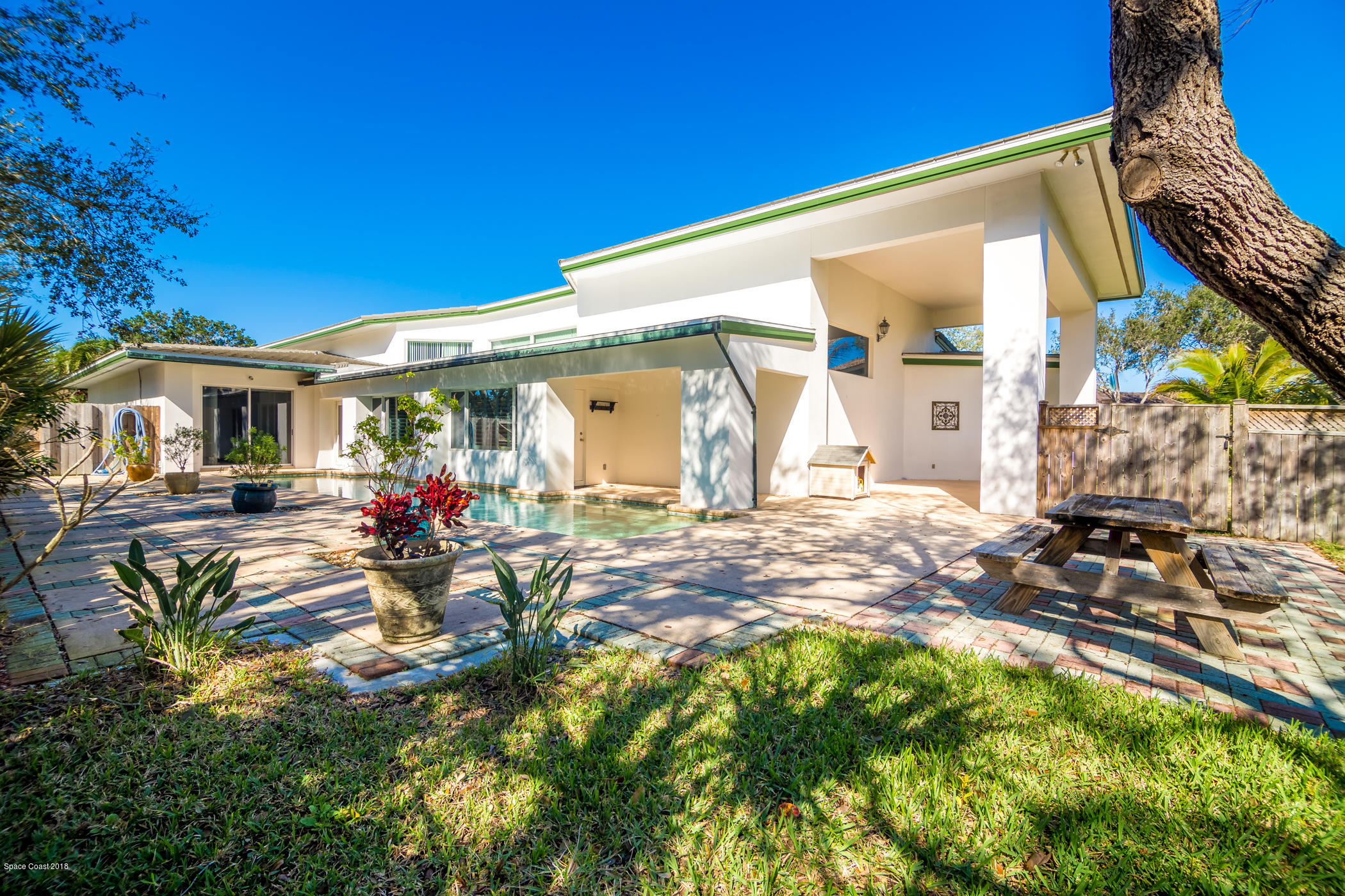 3081 Rio Baya North Melbourne, FL 32903 - Photo 27 of 31 a view of a house with backyard porch and sitting area