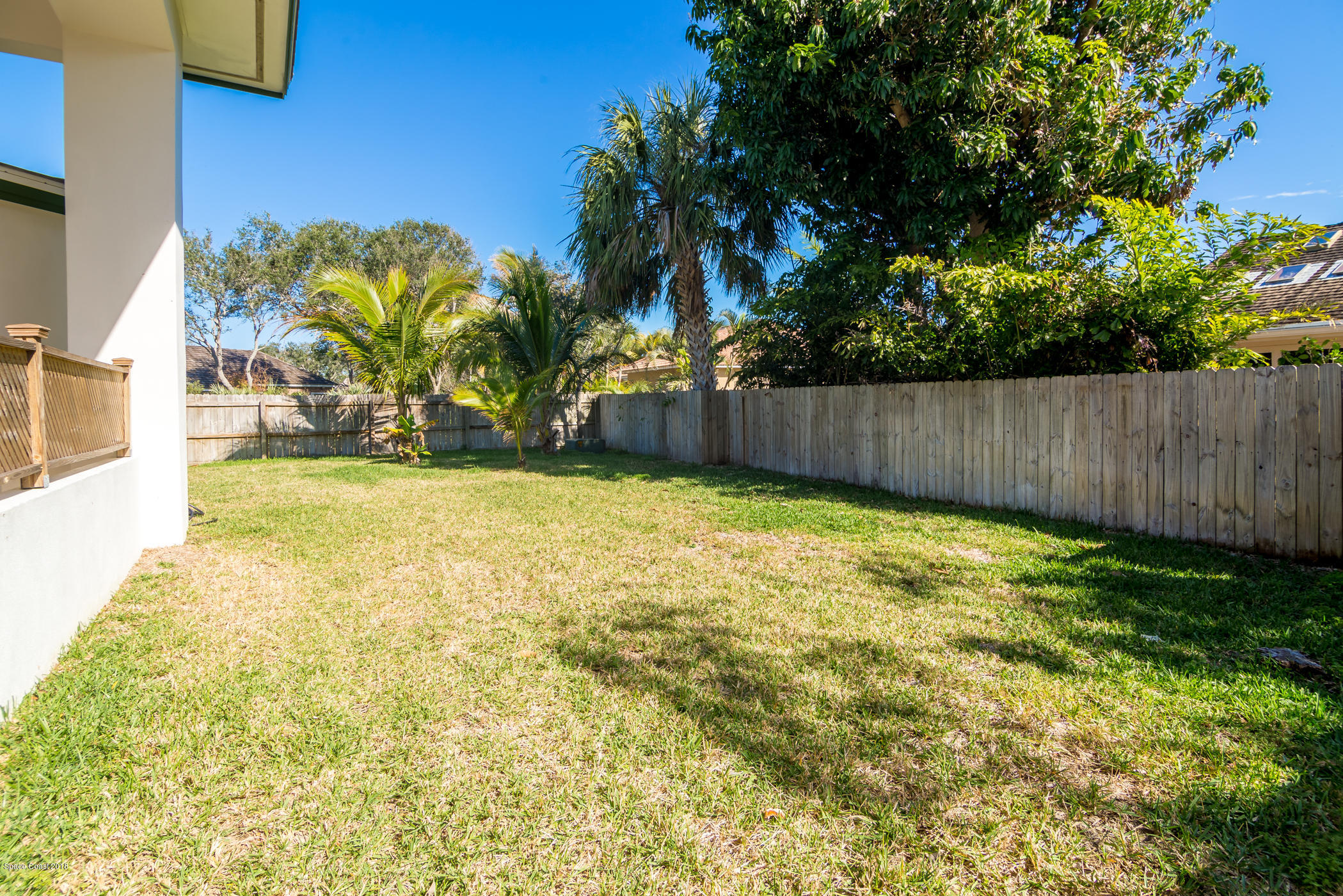 3081 Rio Baya North Melbourne, FL 32903 - Photo 28 of 31 a view of a yard with a trees