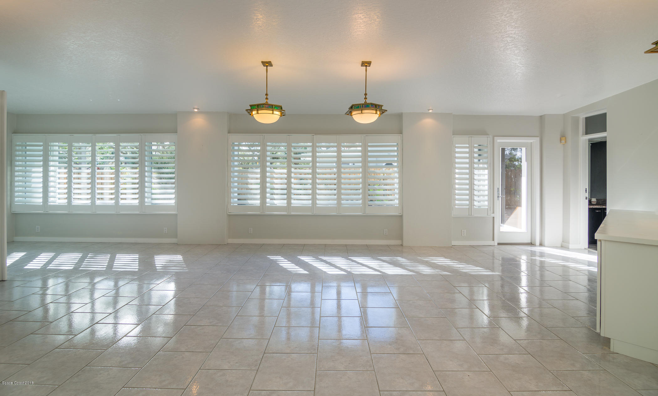 3081 Rio Baya North Melbourne, FL 32903 - Photo 10 of 31 a view of an empty room with window and hardwood floor