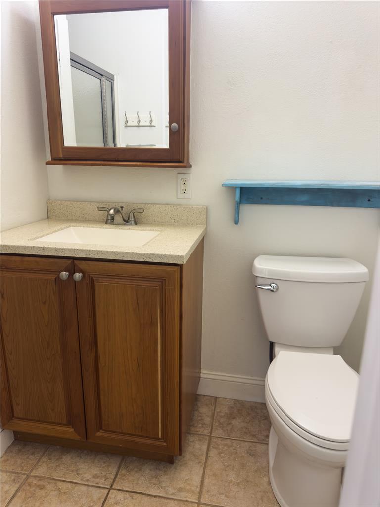 2202 High Meadow Road Coopersburg, PA 18036 - Photo 23 of 41 Tiled flooring and a wooden vanity define this functional bathroom space.