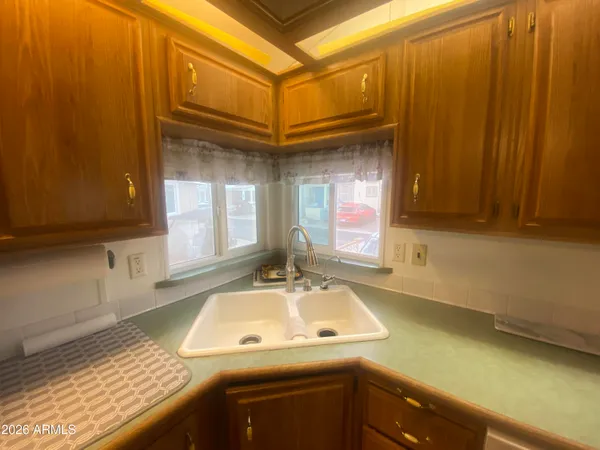 a kitchen with a sink and cabinets