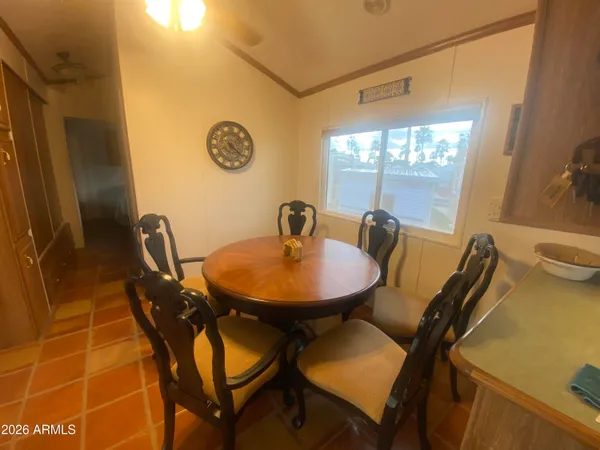 a view of a dining room with furniture and a table