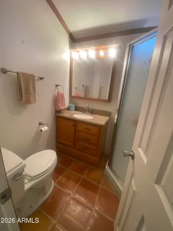 a bedroom with a bed and a mirror