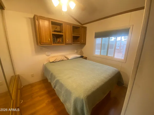 a bathroom with a sink mirror vanity and toilet
