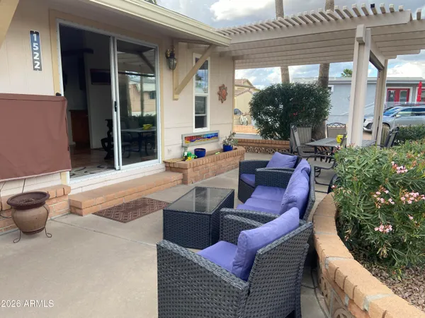 a outdoor living space with furniture and a potted plant