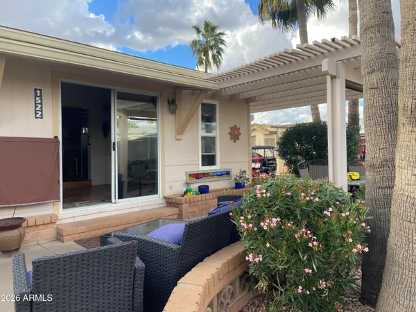 a outdoor living space with furniture and a potted plant