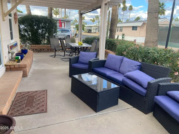 a outdoor living space with furniture and a potted plant