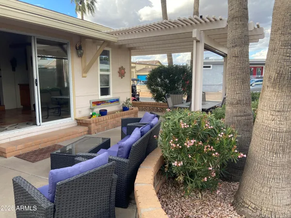 a view of a chairs and table in a patio