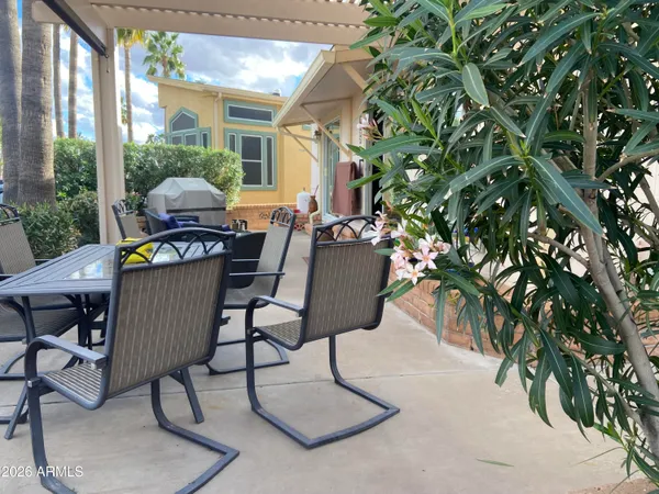 a view of a building with sitting area