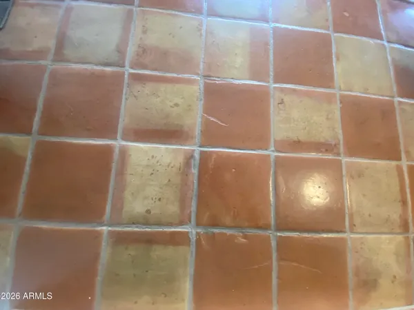 a kitchen with a sink a stove a refrigerator and cabinets