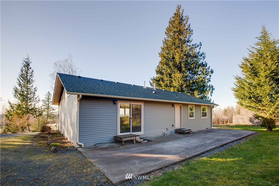 6902 Goodwin Road Everson, WA 98247 - Photo 14 of 39 a view of a house with backyard and a tree