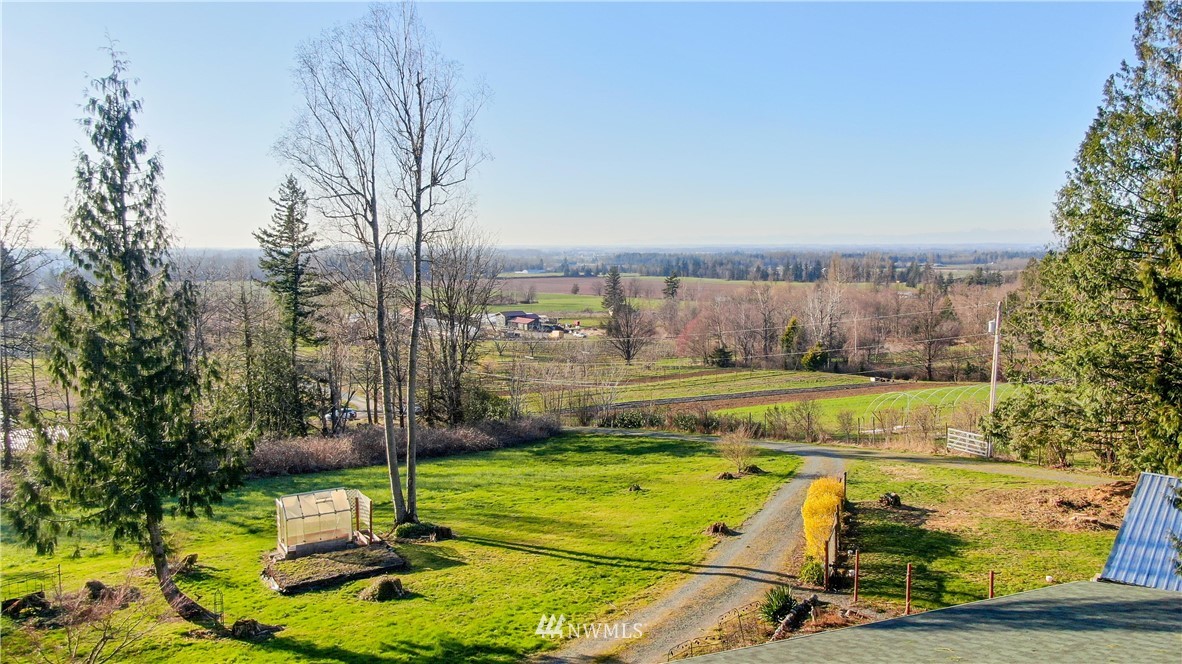 6902 Goodwin Road Everson, WA 98247 - Photo 10 of 39 a view of a swimming pool with a yard