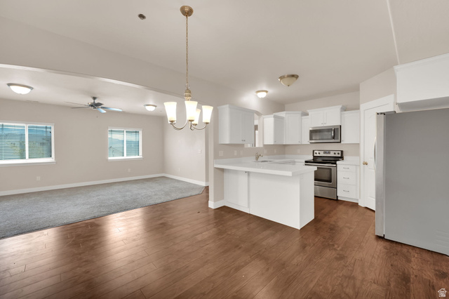 1823 North Crest Road Saratoga Springs, UT 84045 - Photo 18 of 18 Kitchen with open floor plan, hanging lights, stainless steel appliances, light countertops, and a peninsula