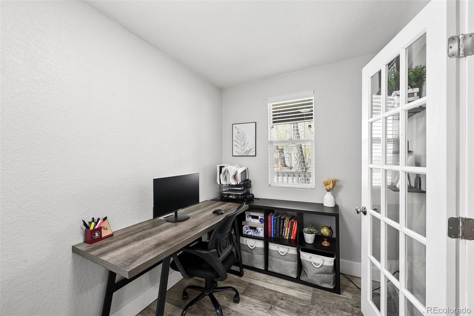 800 South Krameria Street Denver, CO 80224 - Photo 11 of 32 a view of a workspace with furniture and a window