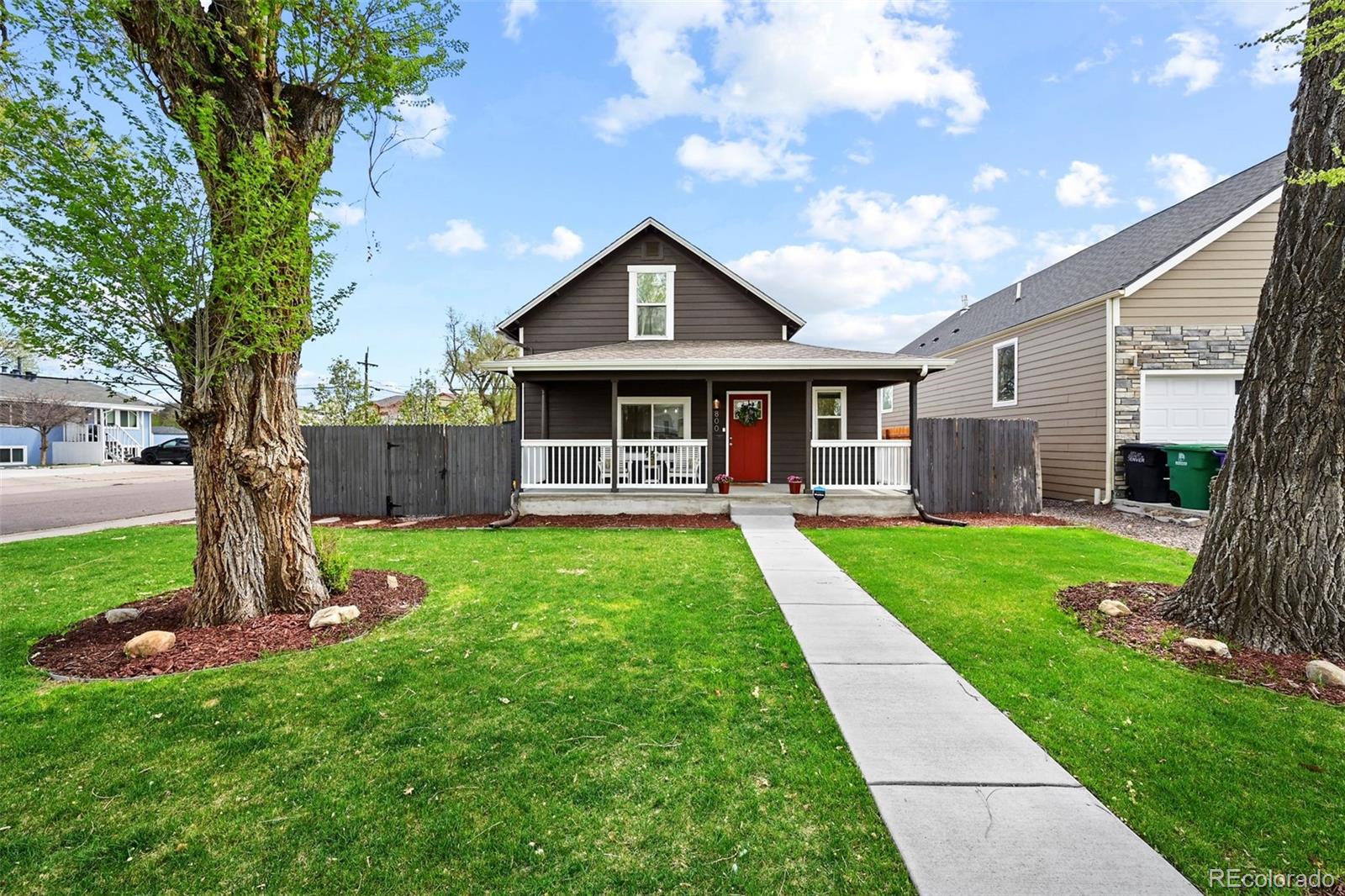 800 South Krameria Street Denver, CO 80224 - Photo 2 of 32 a front view of a house with a yard