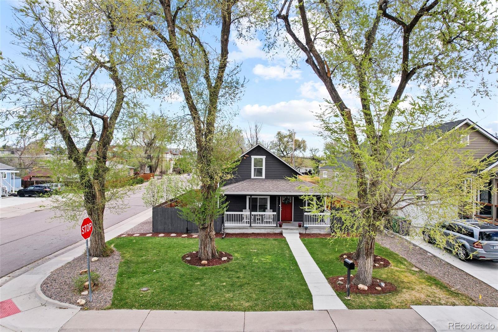 800 South Krameria Street Denver, CO 80224 - Photo 24 of 32 front view of a house with a yard