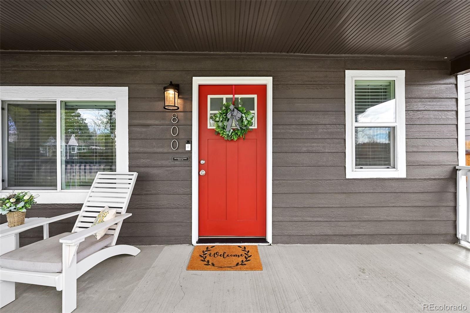 800 South Krameria Street Denver, CO 80224 - Photo 3 of 32 a front view of a house with outdoor seating