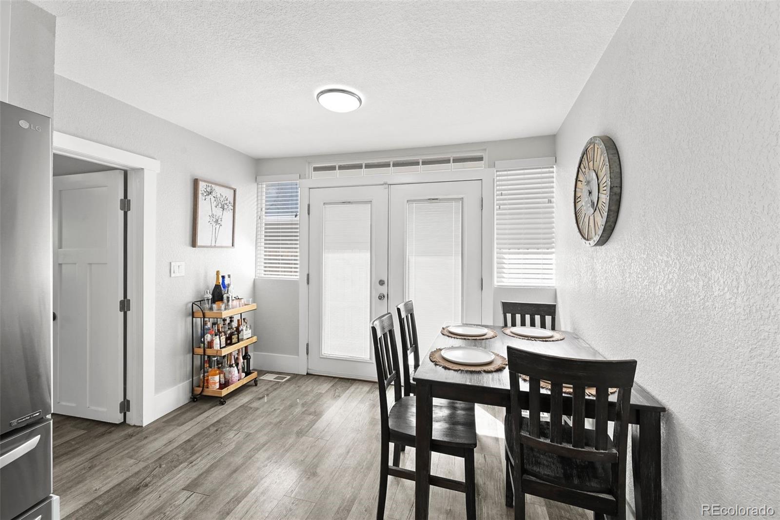 800 South Krameria Street Denver, CO 80224 - Photo 9 of 32 a view of livingroom with furniture wooden floor and front door