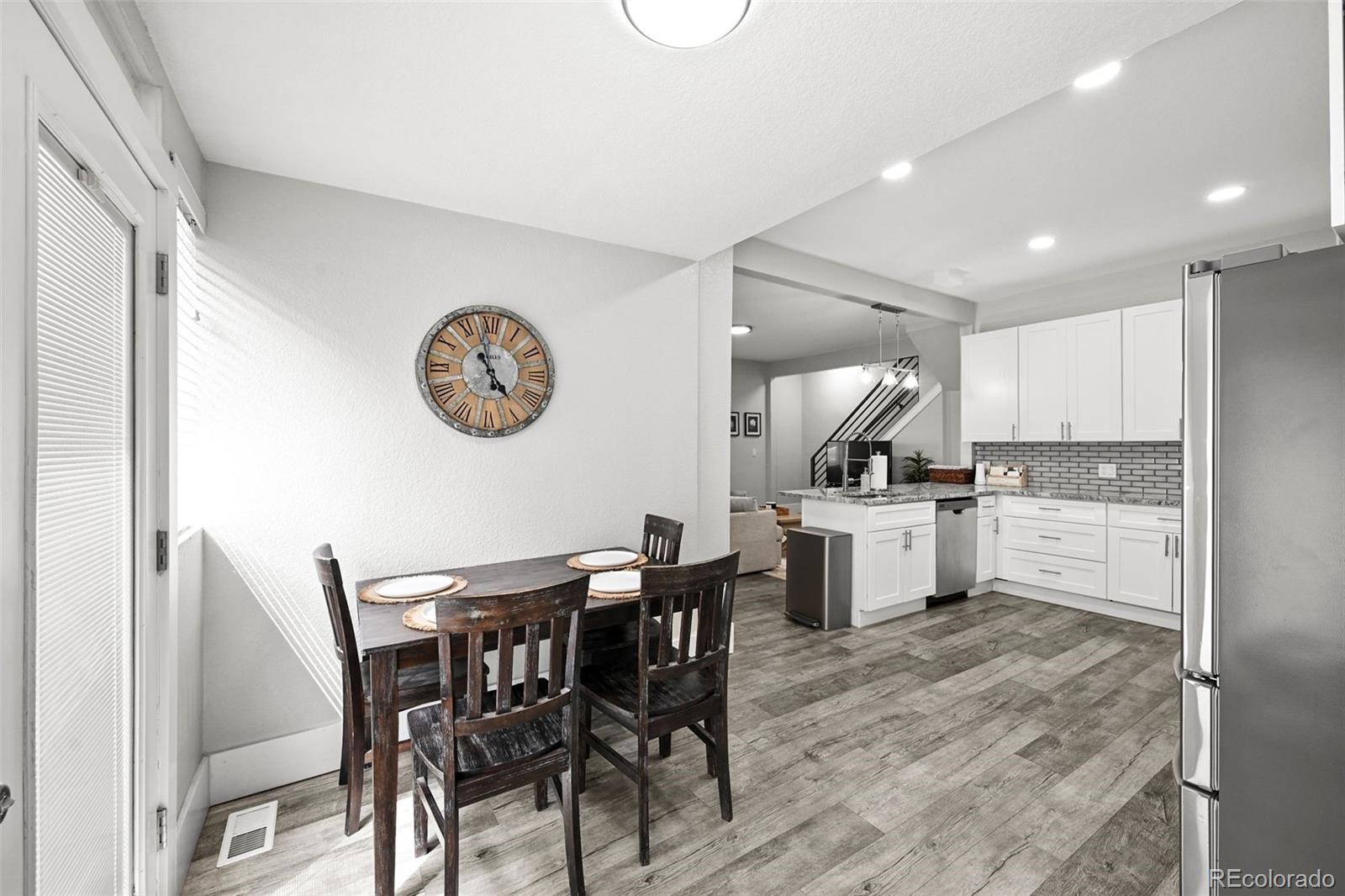 800 South Krameria Street Denver, CO 80224 - Photo 10 of 32 a view of kitchen with cabinets and wooden floor