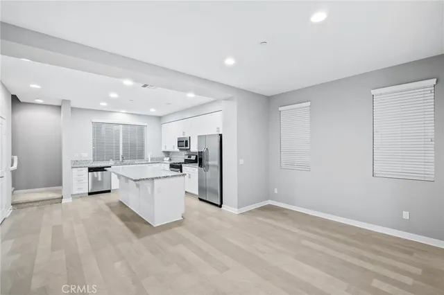 a bathroom with a sink toilet and a mirror