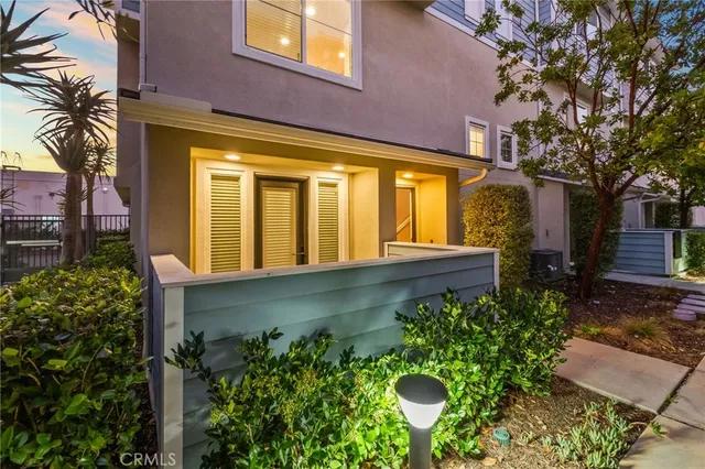 front view of a house with a garden