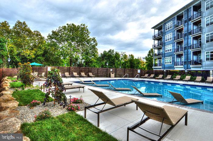 131 Bridge Street, Unit 2B22402 Phoenixville, PA 19460 - Photo 47 of 104 a view of swimming pool with outdoor seating and plants