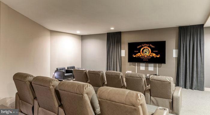 131 Bridge Street, Unit 2B22402 Phoenixville, PA 19460 - Photo 70 of 104 a living room with furniture and a flat screen tv