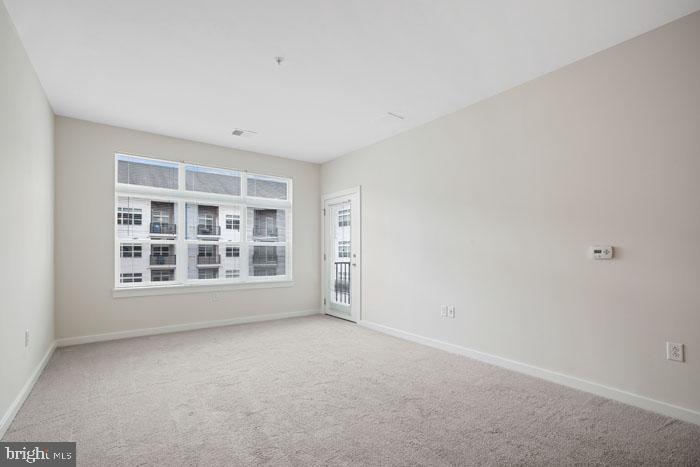 131 Bridge Street, Unit 2B22402 Phoenixville, PA 19460 - Photo 99 of 104 a view of an empty room with a window