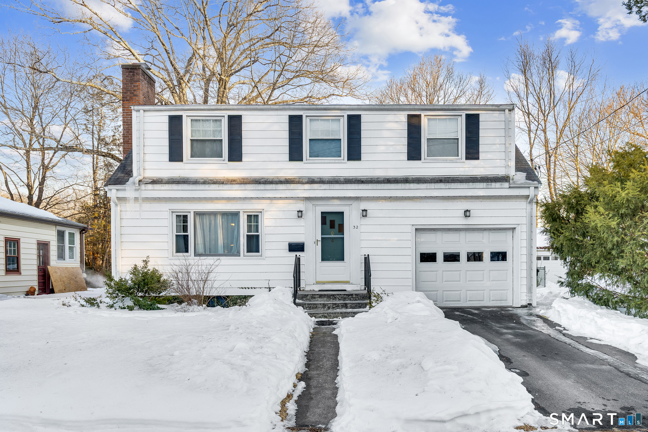 32 Dawes Avenue Hamden, CT 06517 - Photo 1 of 1 a front view of a house with garage