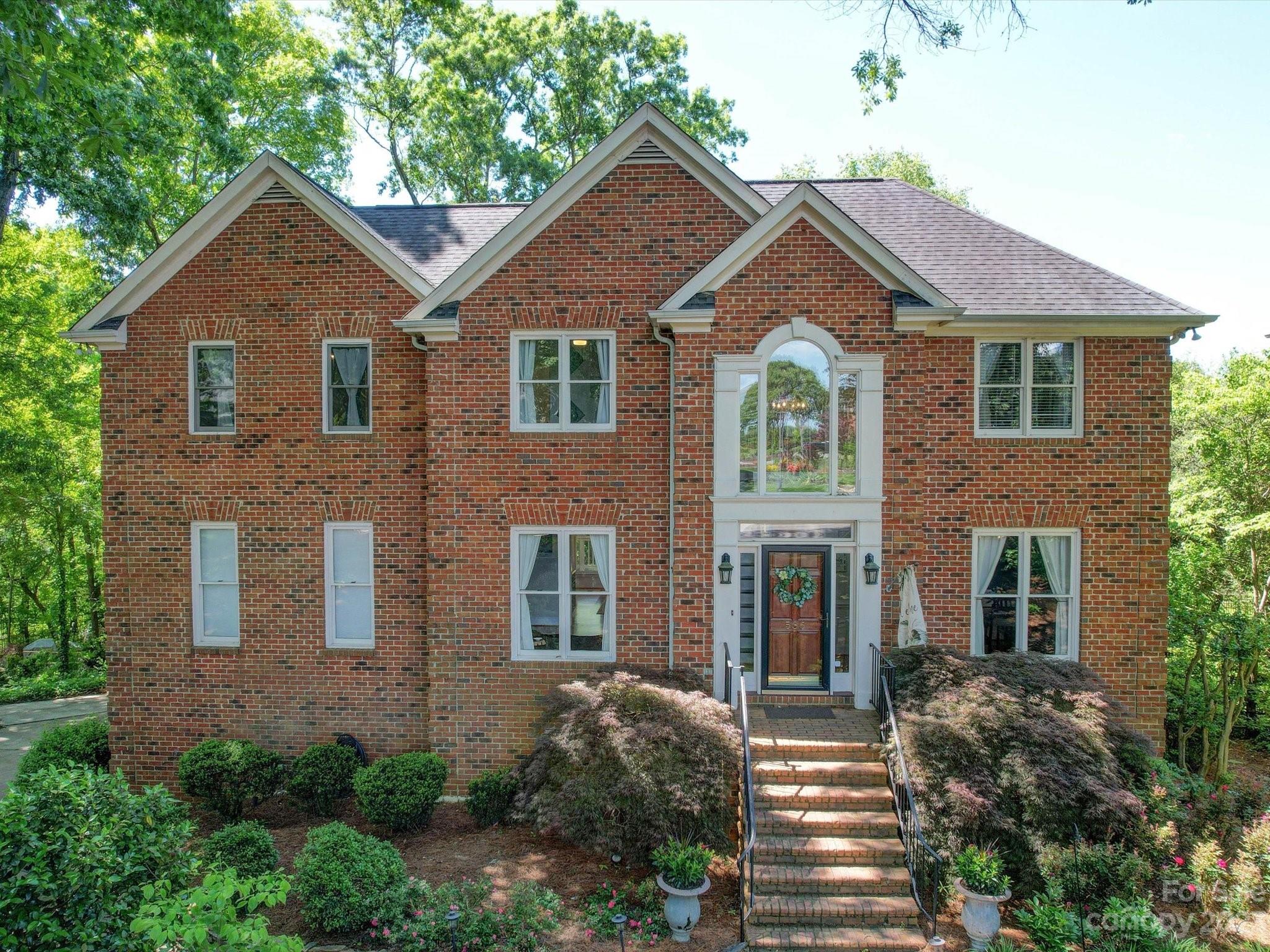 536 Beacon Knoll Lane Fort Mill, SC 29708 - Photo 1 of 45 a front view of a house with yard and parking