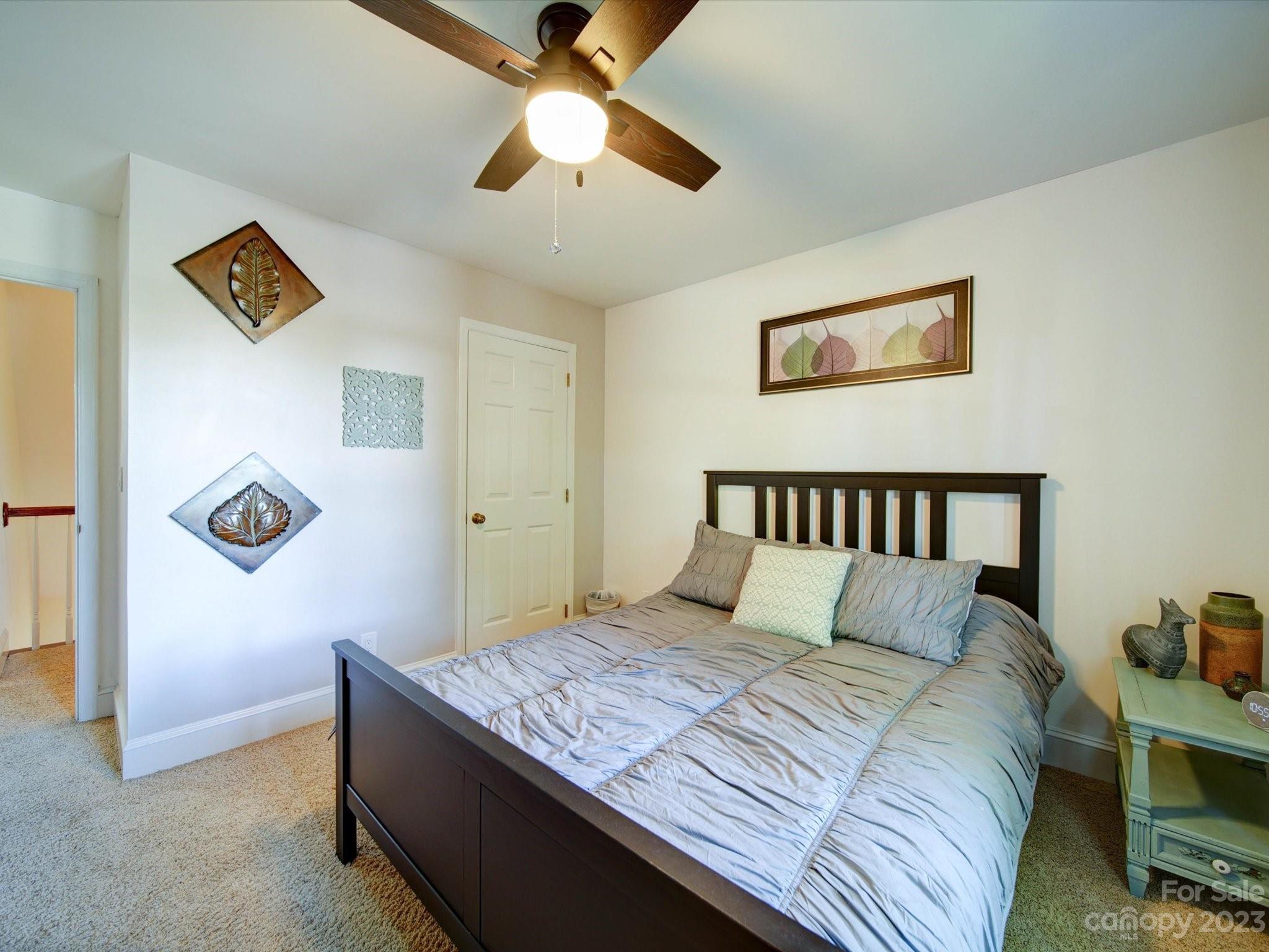 536 Beacon Knoll Lane Fort Mill, SC 29708 - Photo 26 of 45 a bedroom with a bed and a chandelier