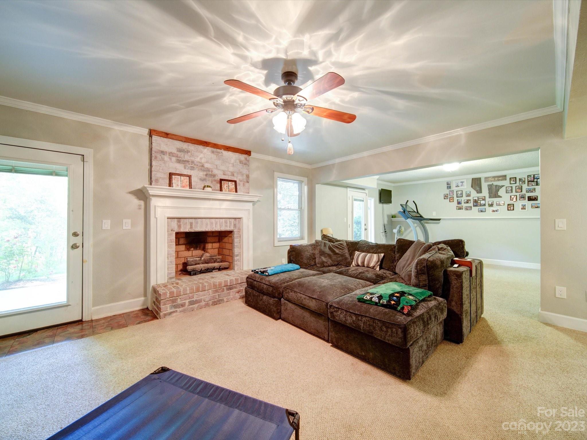 536 Beacon Knoll Lane Fort Mill, SC 29708 - Photo 28 of 45 a living room with furniture and a fireplace