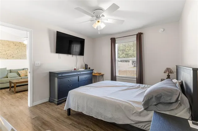 a bedroom with a bed and a television